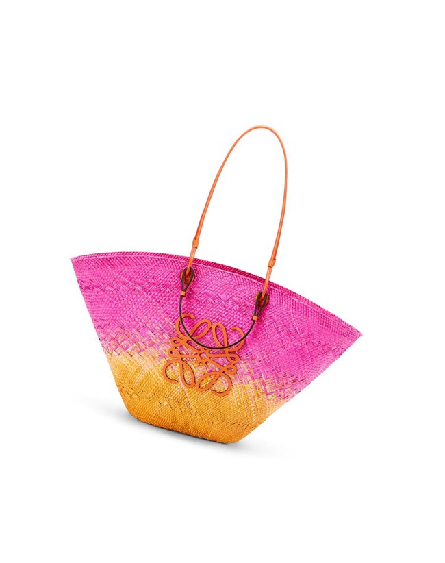 Loewe Large Anagram Basket bag in iraca palm and calfskin Fuchsia / Orange | IS5601438